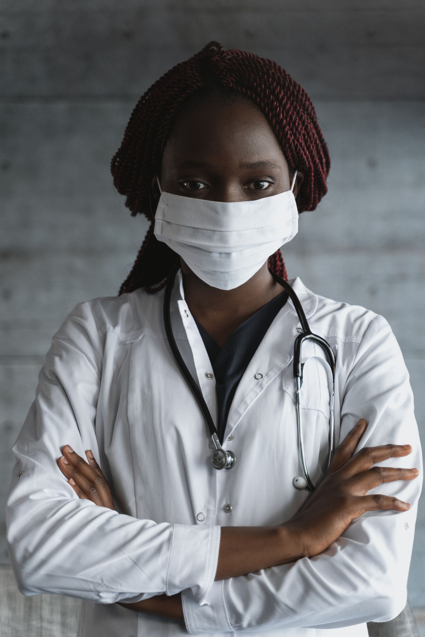 A clinician in a lab coat, representing trusted professional access to the portal.